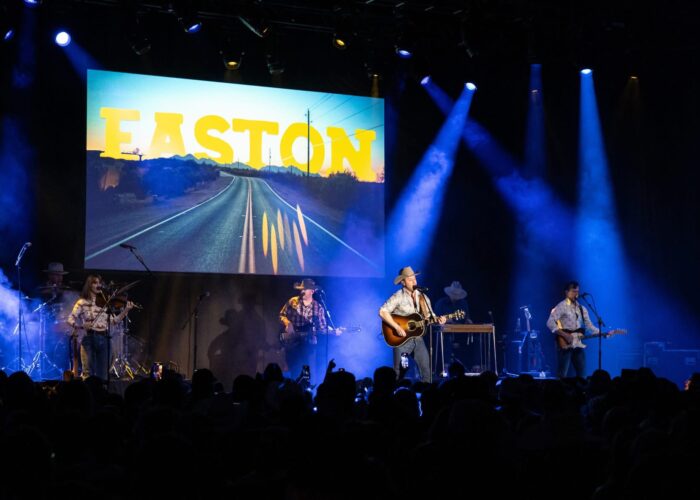 Easton Corbin band in concert, with lights, fog, and a crowd